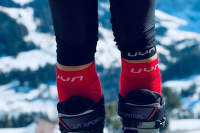 où se terminent les chaussettes et où commencent les trois quarts de longueur.